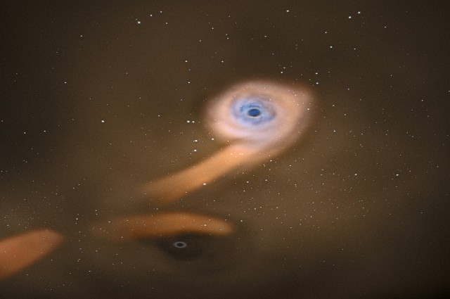 Уметничка перспектива на бинарен систем од супермасивни црни дупки/ Заслуги ESA—C. Carreau